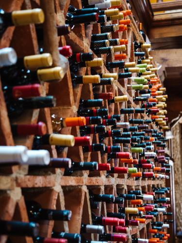 a bunch of wine bottles lined up in a wall at Posada Real de Carreteros in Casarejos