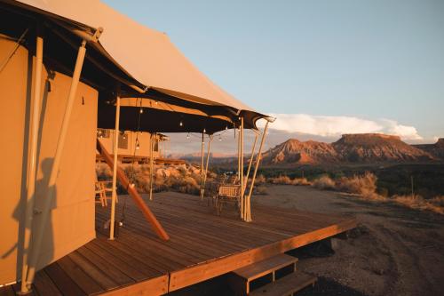 a house with a deck with a view of the desert at Zion Wildflower in Virgin
