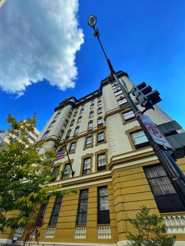 a tall building with a traffic light in front of it at The Architect in Washington, D.C.