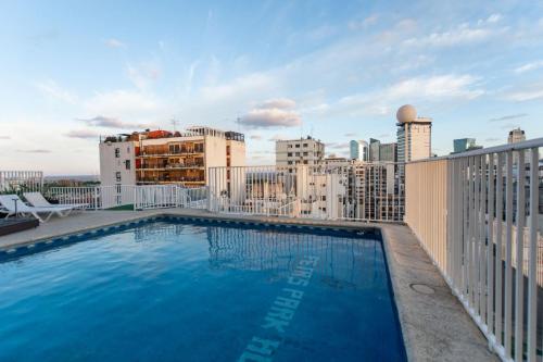 a large swimming pool on the roof of a building at Feir's Park Hotel & Rooftop in Buenos Aires