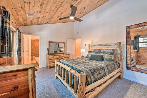 a bedroom with a bed and a wooden ceiling at North Creek Family Cabin - 3 Mi to Gore Mountain! in North Creek