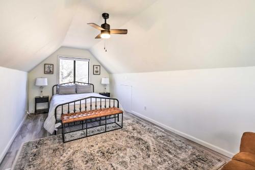 a bedroom with a bed and a ceiling fan at Dock and Pool Access Lakefront Grove Home! in Grove