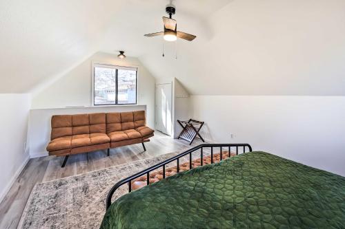a bedroom with a bed and a couch at Shared Boat Dock Lakefront Grove Getaway! in Grove