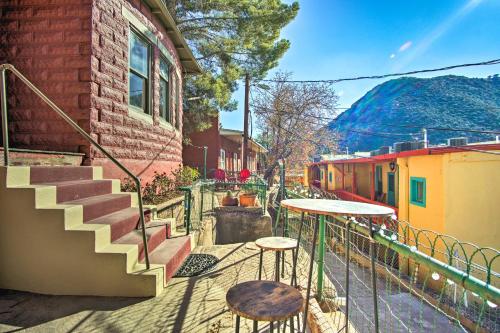 a patio with a table and two stools and stairs at Bisbee Home Fantastic Views and Walkable Location! in Bisbee
