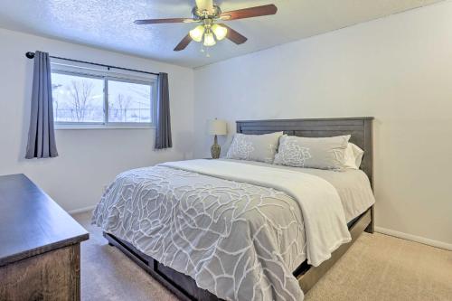 a bedroom with a bed and a ceiling fan at Millcreek Home with Mtn View Less Than 8 Mi to SLC! in Millcreek