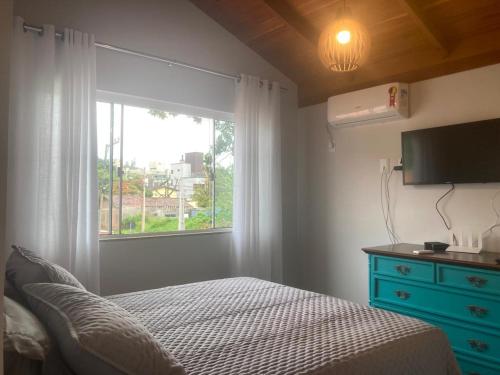 Postel nebo postele na pokoji v ubytování Vila Madu