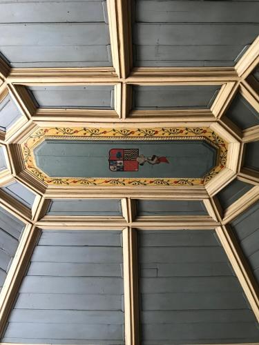 a ceiling in a building with a painting on it at Quinta da Porta - Solar de Vale de Prazeres in Vale de Prazeres