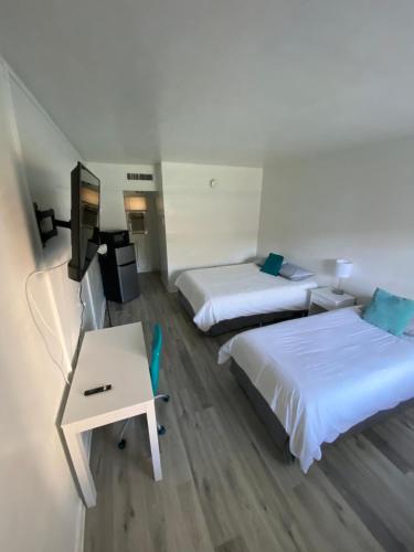 Ένα ή περισσότερα κρεβάτια σε δωμάτιο στο Uptown Inn & Suites