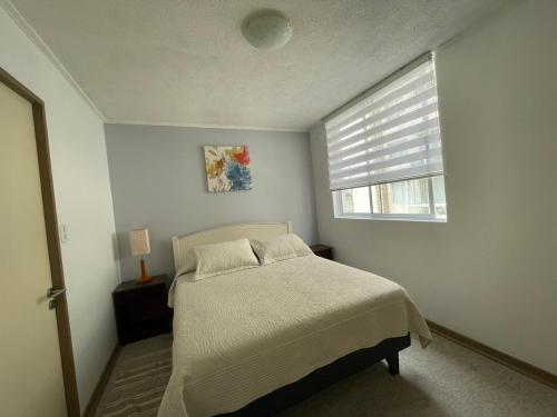 Кровать или кровати в номере Departamento Full La Serena