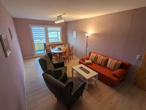 a living room with a couch and a table at Ferienwohnung Elbaue in Barby