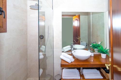 a bathroom with a sink and a shower at Can Roca in Petra