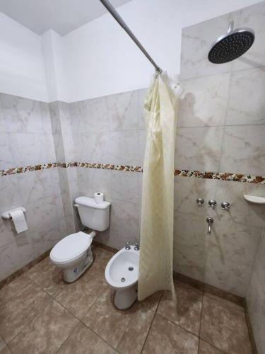 a bathroom with a toilet and a bidet at casa Mia Fausti Cafayate, salta in Cafayate