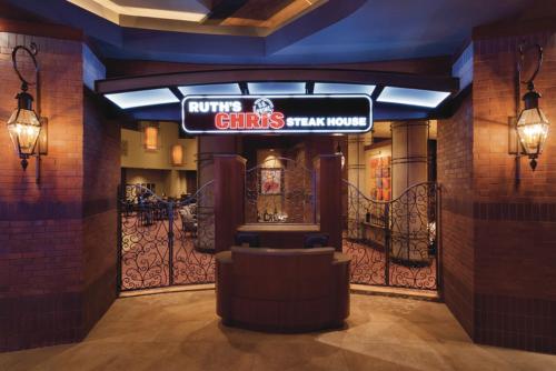 a restaurant with a sign for a chinese drink house at Harrah's Cherokee, A Caesars Destination in Cherokee