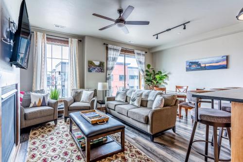 a living room with a couch and a table at Nucleus 303 in Columbia Falls