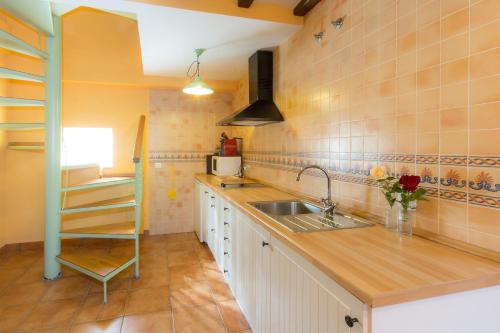 a kitchen with a sink and a counter top at Casa Fresneda in Fresneda de la Sierra Tirón