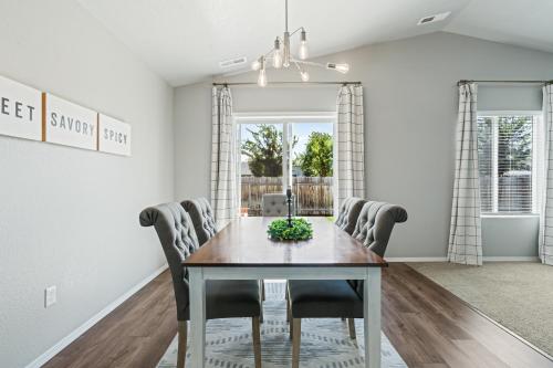 a dining room with a table and chairs at Spacious Cool Springs! Central Nampa 3 Bed in Nampa