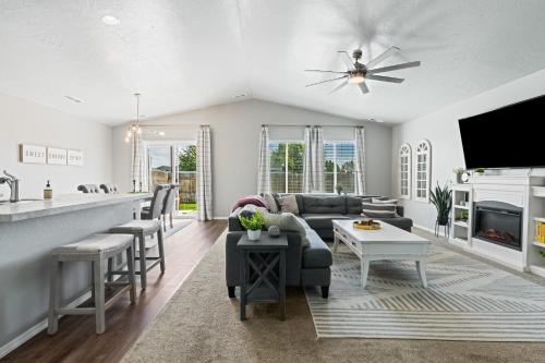 a kitchen and living room with a couch and a table at Spacious Cool Springs! Central Nampa 3 Bed in Nampa
