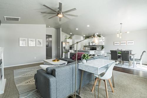 a living room with a couch and a table at Spacious Cool Springs! Central Nampa 3 Bed in Nampa