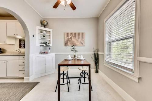 a kitchen with a table and two stools at Global Cup The Dreamy Escape on Lower Greenville in Dallas