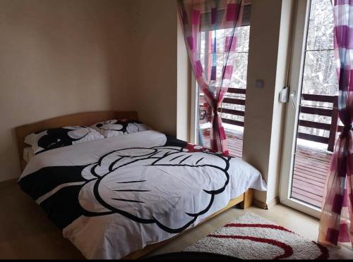 Ένα ή περισσότερα κρεβάτια σε δωμάτιο στο Oaza mira