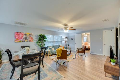 a living room with a table and a dining room at Modern and Spacious Apartment Minutes to FW and Stockyards in Fort Worth
