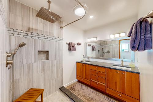 a bathroom with a sink and a shower at Mariners Court - 4 Laurel St Unit 219 in Rehoboth Beach