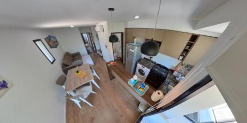 an overhead view of a living room and a kitchen at riviere, 1 dormitorio in Rosario
