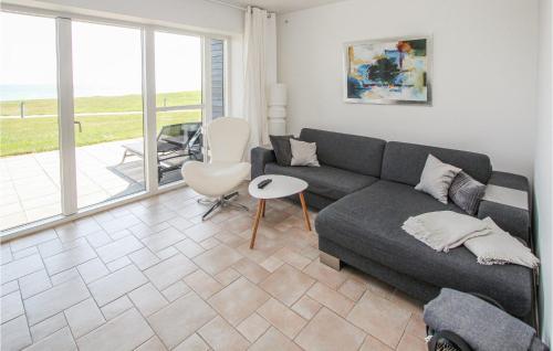a living room with a couch and a table at Gorgeous Apartment In Samsø With Wifi in Ballen