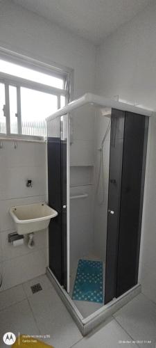 a bathroom with a shower and a sink at Temporada Copacabana Salu in Rio de Janeiro