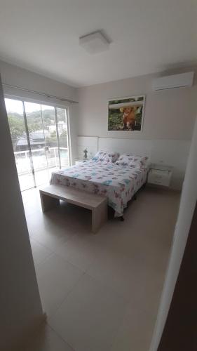 Krevet ili kreveti u jedinici u objektu Casa de Praia em PONTA DAS CANAS, FLORIANÓPOLIS