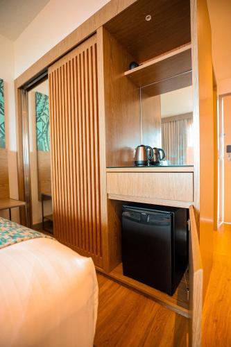 Postel nebo postele na pokoji v ubytování Lava Hotel