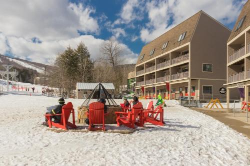 a group of people riding a roller coaster in the snow at Our Home on a Hill in Bethel