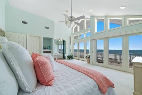a bedroom with a bed with a view of the ocean at Oceanfront/Zero Steps to Beach/Views/4BR in Gulf Shores