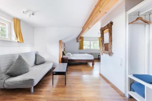a living room with a couch and a table at Sonnhof in Bad Ischl