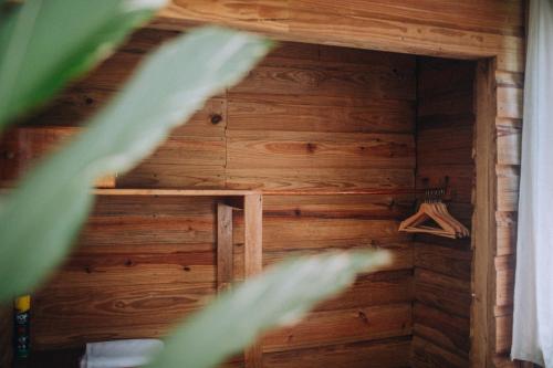 a room with a wooden wall with a ladder in it at Jaguar Creek in Good Living Camp