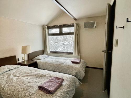 Tempat tidur dalam kamar di 19 Accommodation