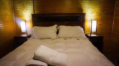 Cama o camas de una habitación en Hospedaje Amapola