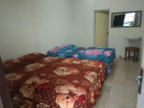 Postel nebo postele na pokoji v ubytování BROMO B&B