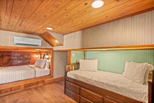a bedroom with two beds on a boat at The Gypsy Palace in Saint Augustine