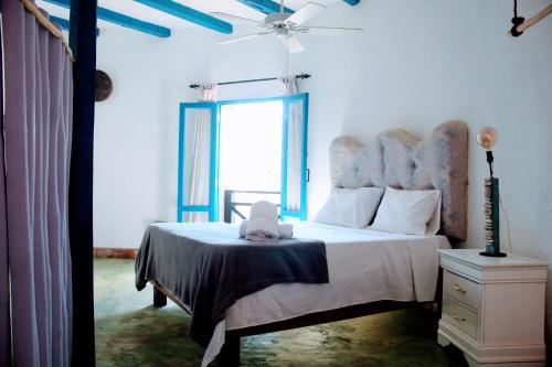 Una cama o camas en una habitación de El Castillo