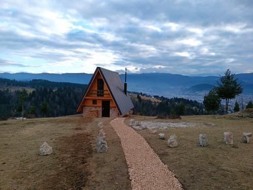 a small cabin on top of a hill at Vikendica Tromedja Pale in Pale