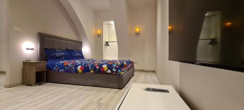 a bedroom with a bed and a tv in it at Highly finished Studio Home in Valletta in Valletta