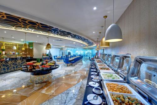 a buffet line with many different types of food at Gevora Hotel in Dubai