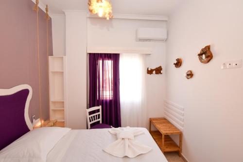 A bed or beds in a room at Rubini City Apartment