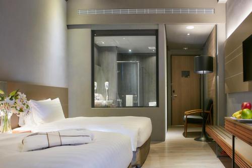 Postel nebo postele na pokoji v ubytování Orient Luxury Hotel