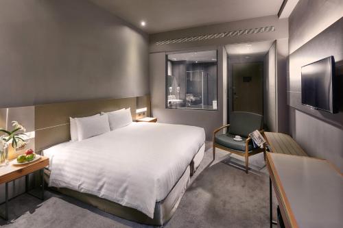 Tempat tidur dalam kamar di Orient Luxury Hotel