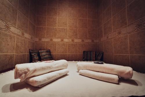 a room with two large pillows on the floor at Pohorje Village Wellbeing Resort - Forest Apartments Videc in Pohorje