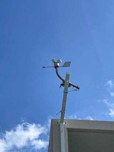 a pole with a camera on top of a building at Dining & Stay 38 Miyahira in Zamami