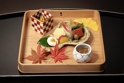 a wooden tray with food on top of it at Gora Kadan in Hakone