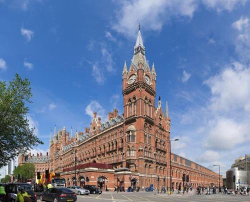 a large building with a clock tower in front of it at Private Double Bedroom in King's Cross St Pancras in London